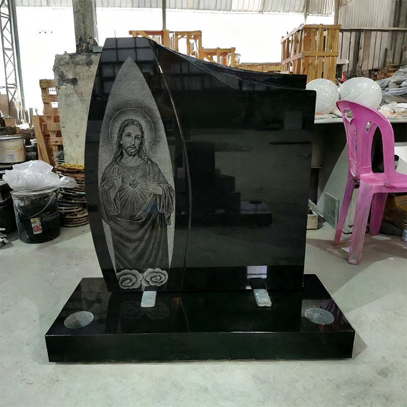 Black Marble Tombstone with Christ Figure
