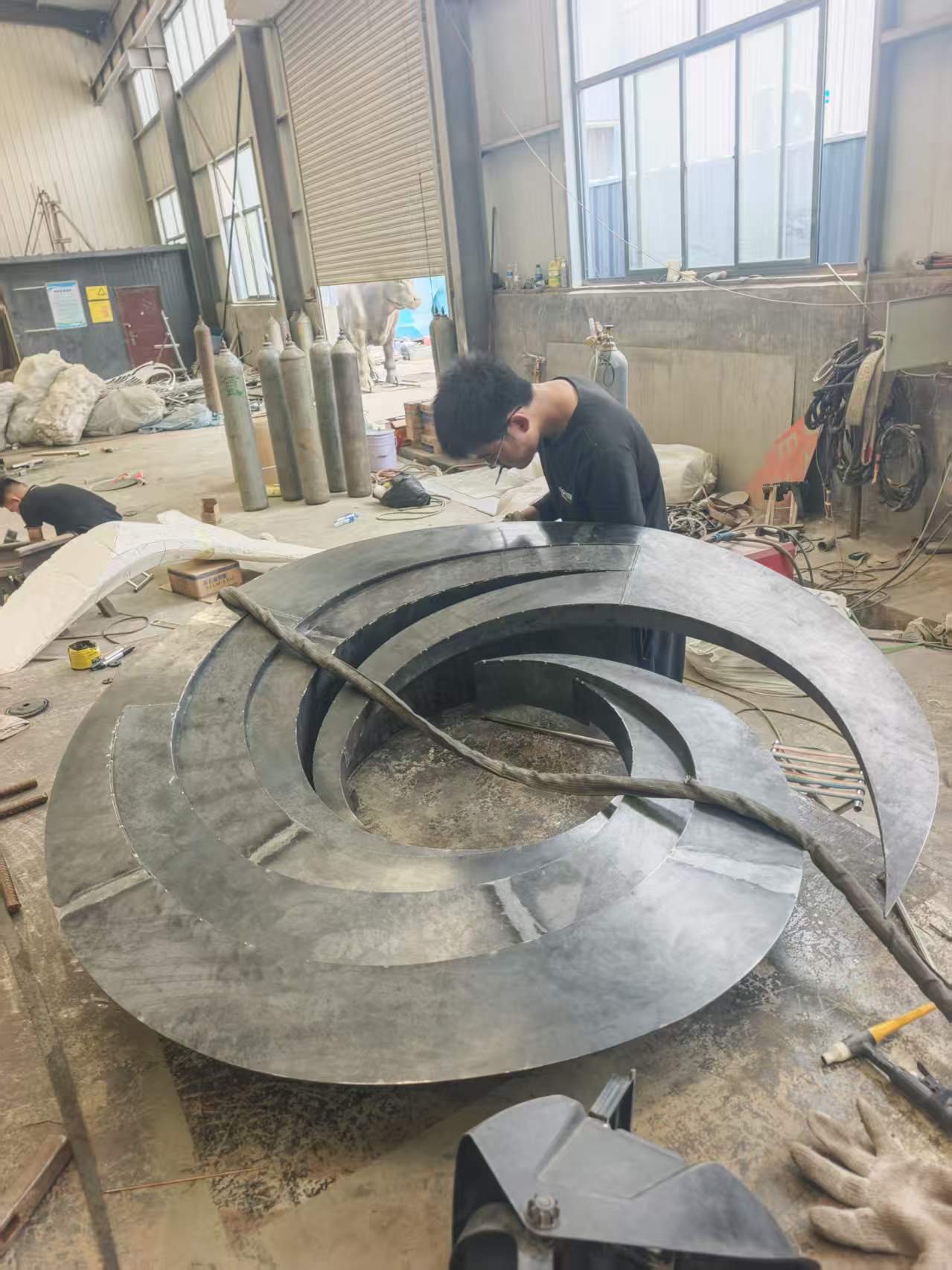 How Is a Large Corten Steel Spiral Sculpture Fabricated for Outdoor Installation?